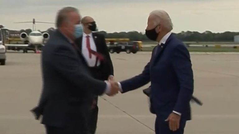 Joe Biden shakes hands while wearing a mask in Wisconsin