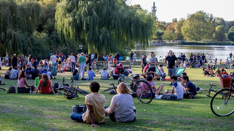 Members of the public relaxing in Regents Park on September 13, 2020 in London, England. Concerned by rising cases of Covid-19, the British government will start enforcing a six-person limit on indoor and outdoor social gatherings in England, although numerous exemptions exist for workplaces, schools, religious functions, and organised sport