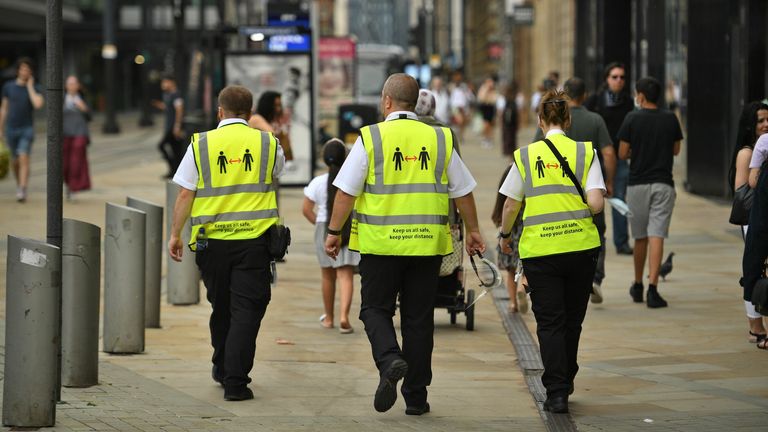 
Metrolink workers wear high vis jackets with that urge social distancing as a precuation against the transmission of the novel coronavirus in Manchester, northwest England, on July 31, 2020. - Britain today "put the brakes on" easing lockdown measures and imposed new rules on millions of households in northern England, following concerns over a spike in coronavirus infections. (Photo by Oli SCARFF / AFP) (Photo by OLI SCARFF/AFP via Getty Images)
