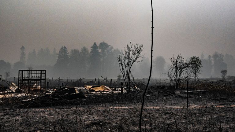 A spot fire smoulders near a lumber yard on September 10, 2020 in Molalla, Oregon.