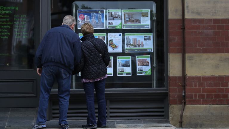 MANCHESTER, ENGLAND - AUGUST 02: People view homes in an estate agents window in Manchester City centre on August 2, 2016 in Manchester, England. Home ownership acroos the country has seen a sharp drop across Britain, particularly in the North. Home ownership in Manchester has fallen from 72% in 2003 to 58% this year according a to a survey by the The Resolution Foundation. (Photo by Christopher Furlong/Getty Images)
