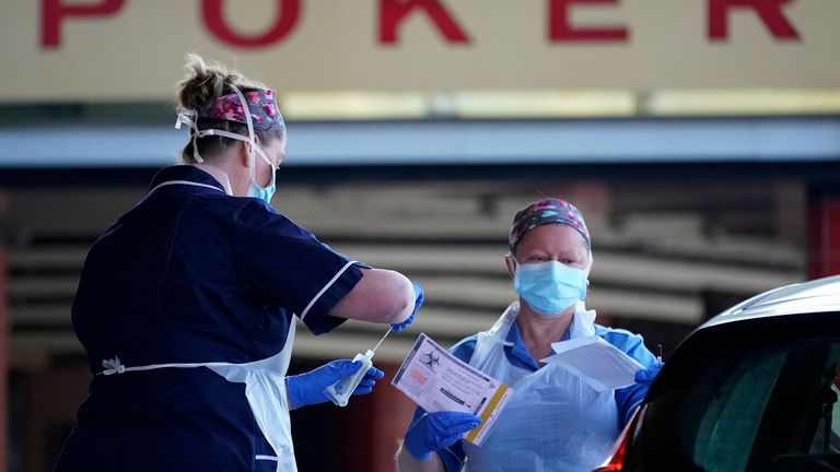 Nurses help NHS workers as they self swab