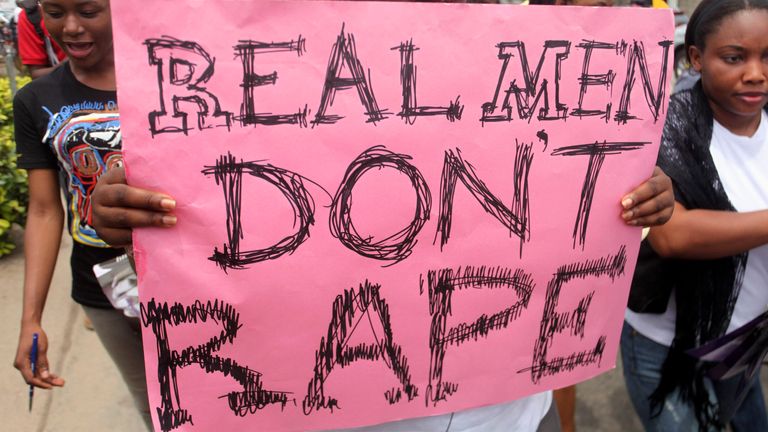 A woman carries a placard during a demonstration on women&#39;s issues, in Lagos, Nigeria