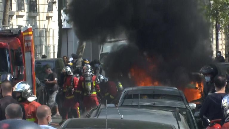 A car was set on fire during protests in Paris today 