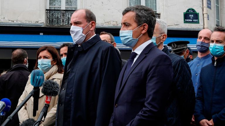 French Prime Minister Jean Castex (centre) speaks to journalists with the French Interior Minister Gerald Darmanin (right) and Paris mayor Anne Hidalgo (left)