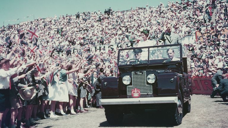 Queen Elizabeth and Prince Philip greet supporters during a Commonwealth visit to Australia in 1954