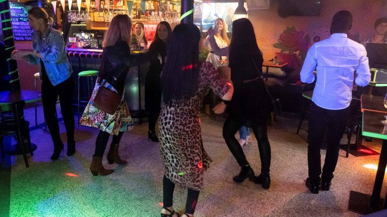 People dancing at a bar in Reykjavik, Iceland