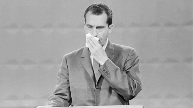 Richard Nixon wipes his brow during the first televised debate against John F Kennedy