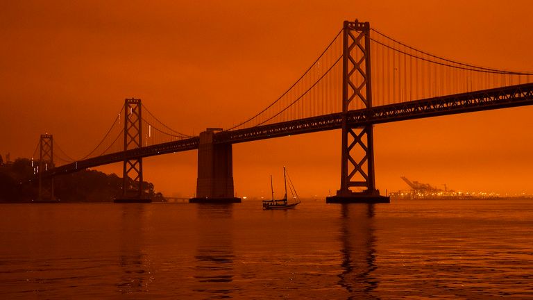 Wildfires blanket San Francisco in darkness and an orange glow 