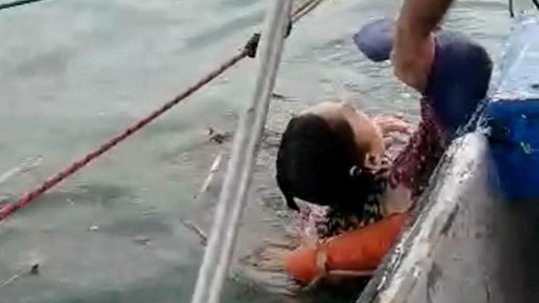 Woman rescued from sea