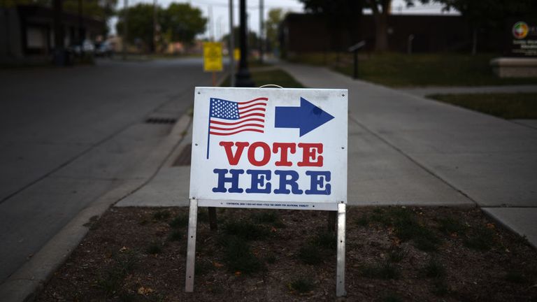 MINNEAPOLIS, MN - AUGUST 14: A sign reading "Vote Here" points toward a polling place for the 2018 Minnesota primary election at Holy Trinity Lutheran Church on August 14, 2018 in Minneapolis, Minnesota. (Photo by Stephen Maturen/Getty Images)
