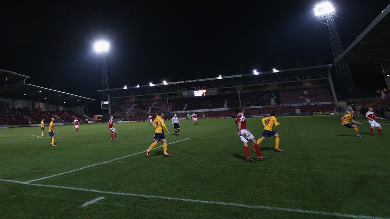 of Wrexham AFC challenges of Oxford United during the FA Cup Second Round match between Wrexham AFC and Oxford United at Racecourse Ground on December 9, 2013 in Wrexham, Wales.