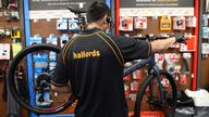 An employee works on a bicycle in a Halfords store, after the government announced a new plan on walking and cycling projects, following the coronavirus disease (COVID-19) outbreak, in Luton, Britain July 28, 2020