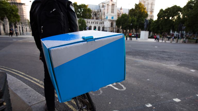 Food delivery by bicycle in Central London, UK.