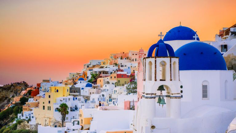 SANTORINI, GREECE - AUGUST 12: (EDITORS NOTE: Image processed using digital filters) A general view of the sunset in the picturesque village of Oia (Ia) on Santorini Island on August 12, 2017 in Mykonos, Greece. (Photo by Claudio Lavenia/Getty Images)