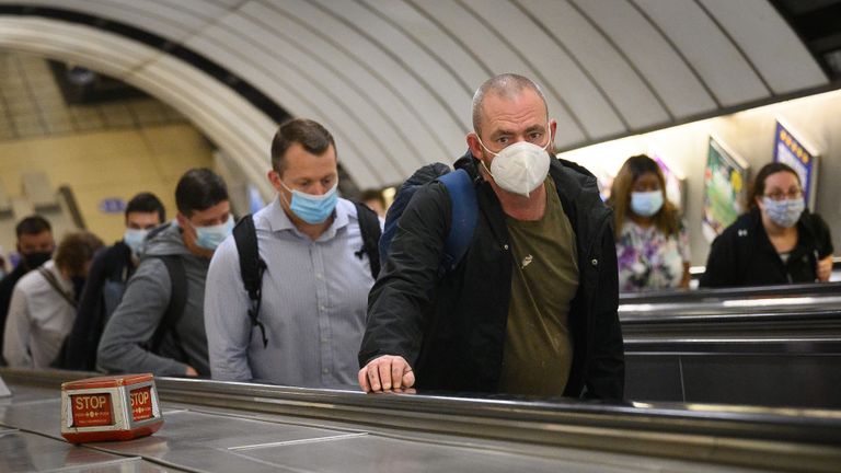 LONDON, ENGLAND - JUNE 15: Commuters wear face masks as they pass through Vauxhall underground station on the first day of their mandatory use while travelling on public transport, on June 15, 2020 in London, England. The British government have relaxed coronavirus lockdown laws significantly from Monday June 15, allowing zoos, safari parks and non-essential shops to open to visitors. Places of worship will allow individual prayers and protective facemasks become mandatory on London Transport. (Photo by Leon Neal/Getty Images)