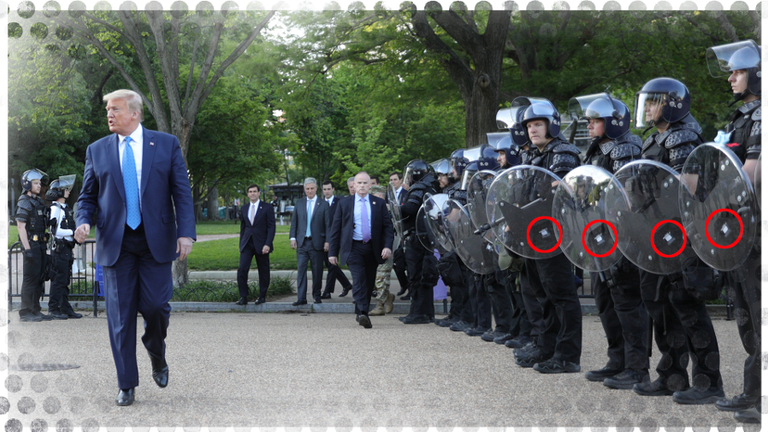 Donald Trump walks near some police carrying British-made shields