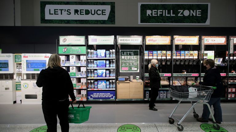 The &#39;Refill Zone&#39; is seen in the UK supermarket Asda, as the store launches a new sustainability strategy, in Leeds, Britain, October 19, 2020. Picture taken October 19, 2020. REUTERS/Molly Darlington
