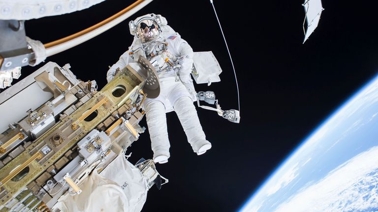jumping astronaut in outer space