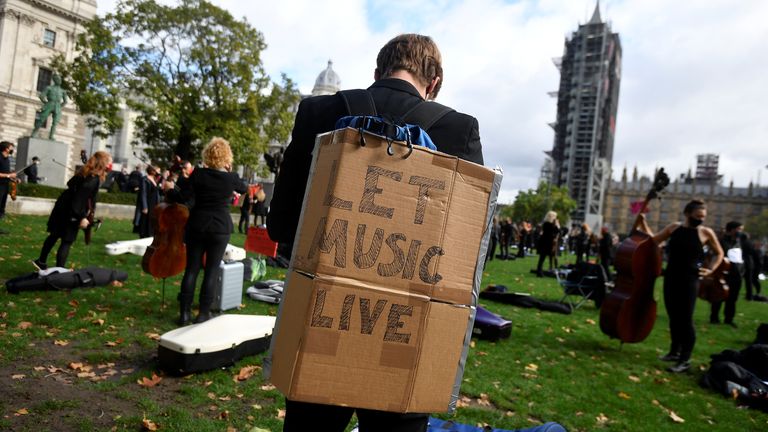 Musicians perform near the houses of Parliament during a protest highlighting their inability to perform live or work during the coronavirus disease (COVID-19) pandemic