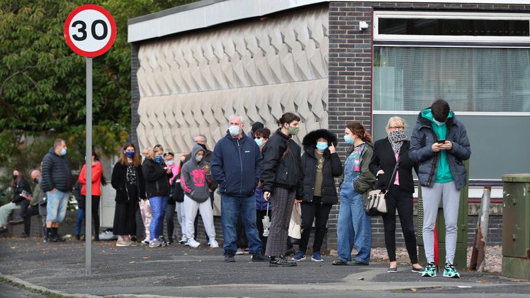 People queuing outside a walk-in coronavirus test centre at Allerton Library in Liverpool amid rising cases across parts of England, with the latest weekly infection figures showing Knowsley and Liverpool have the second and third highest rates, at 498.5 and 487.1 respectively.