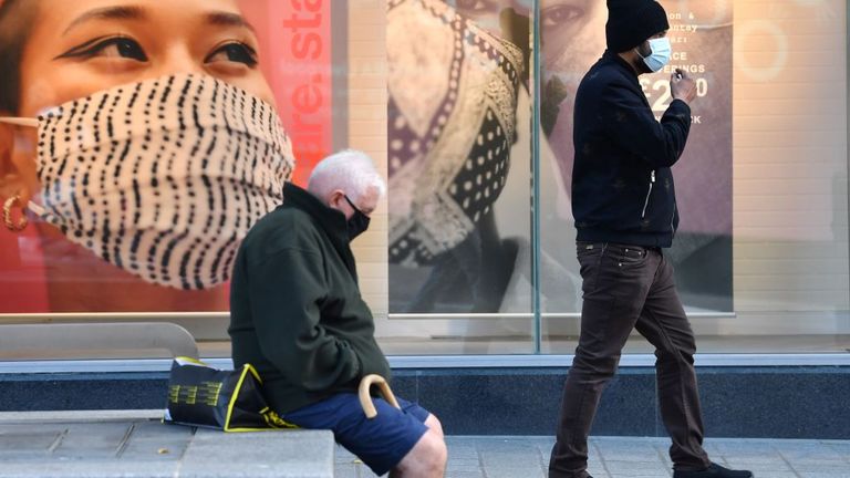 Pedestrians are seen wearing masks in Liverpool 