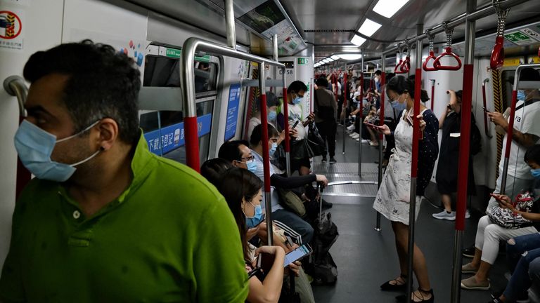 Hong Kong MTR passengers wear masks since the pandemic began