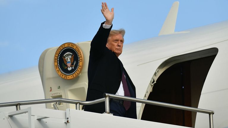 US President Donald Trump steps off Air Force One upon arrival at Andrews Air Force Base in Maryland on October 1, 2020. - The president returned to Washington, DC after attending a fundraiser in Bedminster, New Jersey. 