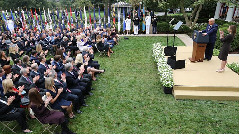 President Donald Trump holds a Rose Garden press conference at the White House with US circuit court judge Amy Coney Barrett (right)