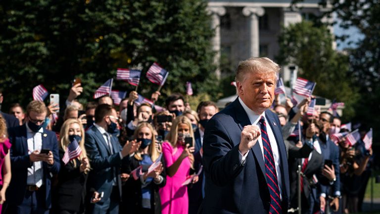 The president is seen leaving the White House as interns cheer him on in the background