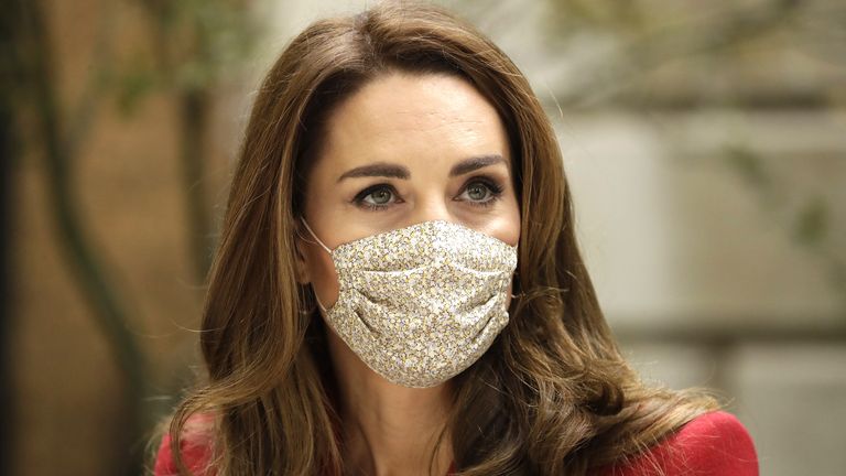 The Duchess of Cambridge listens to pharmacist Joyce Duah (not pictured) during a visit to St. Bartholomew's Hospital in London, to mark the launch of the Hold Still photography project.