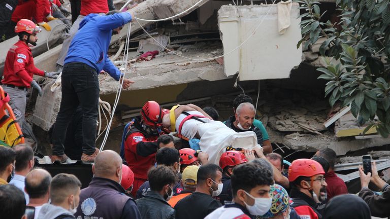 Rescuers and local volunteers carry a wounded victim on a stretcher from a collapsed building after a powerful earthquake struck Turkey&#39;s western coast and parts of Greece, in Izmir, on October 30, 2020. - A powerful earthquake hit Turkey and Greece on October 30, killing at least six people, levelling buildings and creating a sea surge that flooded streets near the Turkish resort city of Izmir. Via Getty Image