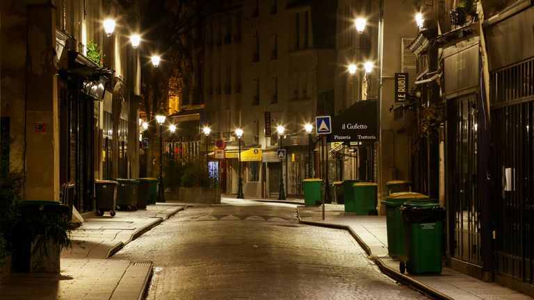 Paris is pictured empty as it enters lockdown early on Friday morning