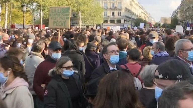 Crowds gathered in Paris to pay their respects to Samuel Paty, a teacher who was killed after discussing caricatures of Prophet Mohammed.
