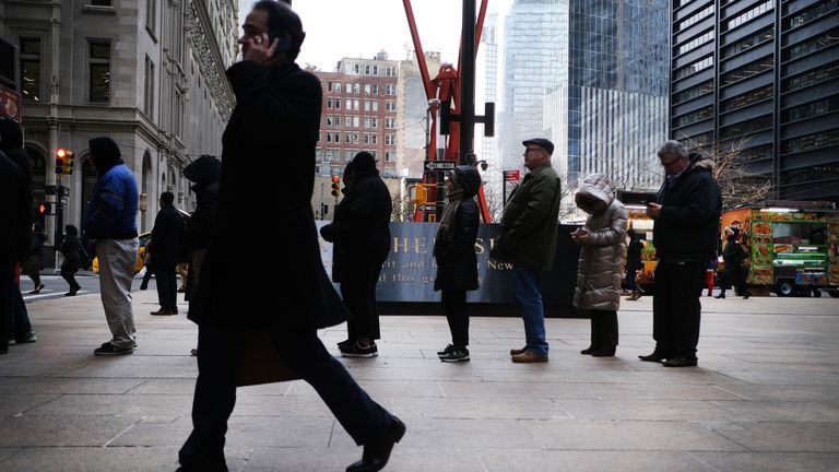 People walk through the financial district on January 30, 2020 in New York City