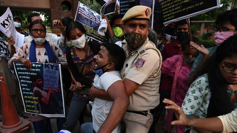 Police clash with protesters after the alleged cremation of the victim&#39;s body against her family&#39;s wishes