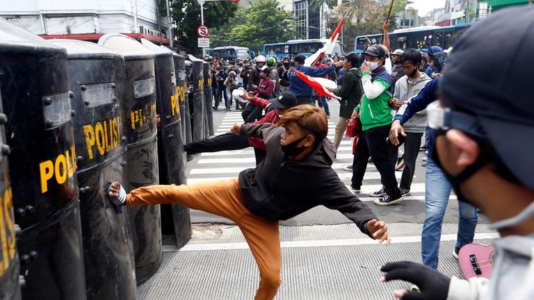 Demonstrators clash with police officers following a protest against the government&#39;s labor reforms in a &#34;jobs creation&#34; bill in Jakarta, Indonesia, October 8, 2020. REUTERS/Ajeng Dinar Ulfiana TPX IMAGES OF THE DAY