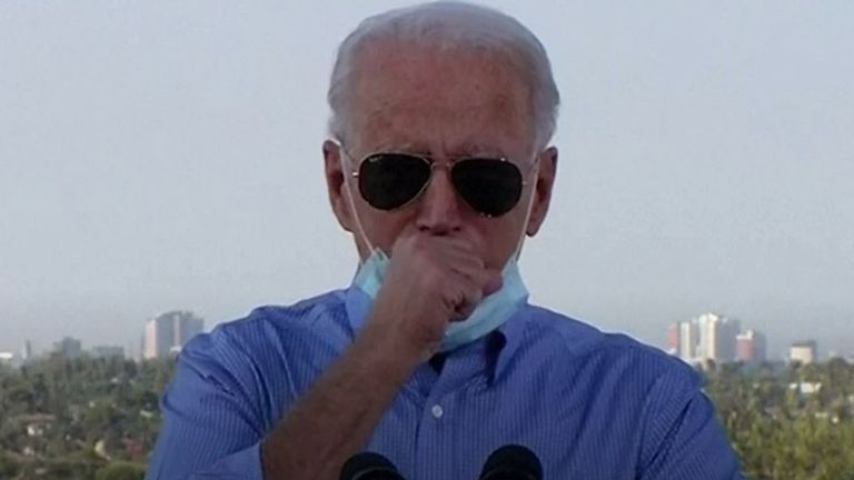 Joe Biden takes a moment to clear throat during a campaign speech