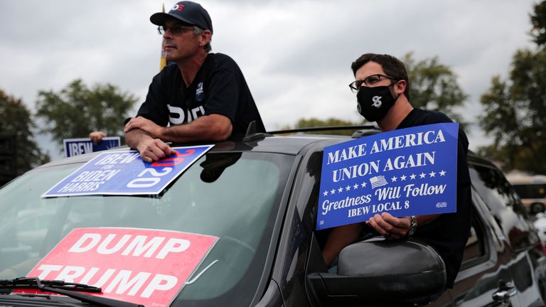 Supporters listen to Democratic presidential candidate Joe Biden during a drive-in campaign event in Toledo, Ohio