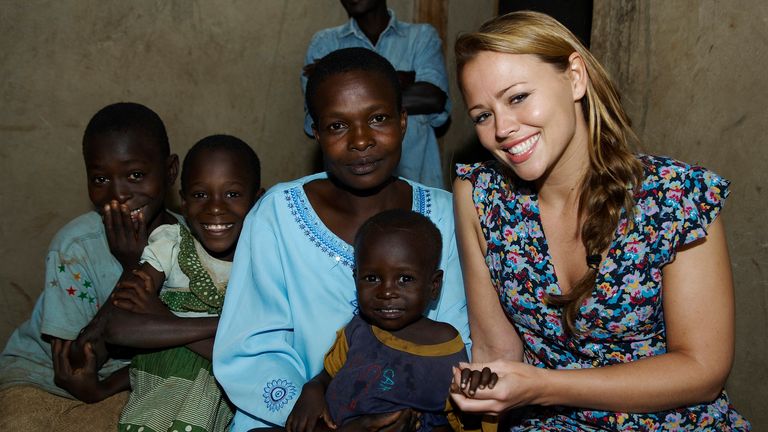 Girls Aloud star Kimberley Walsh poses with a family