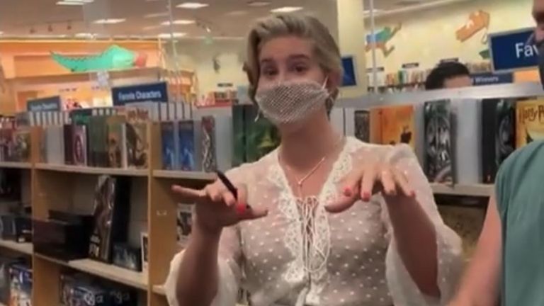 Musician Lana Del Rey came under fire on social media after wearing a mesh face mask to a book signing