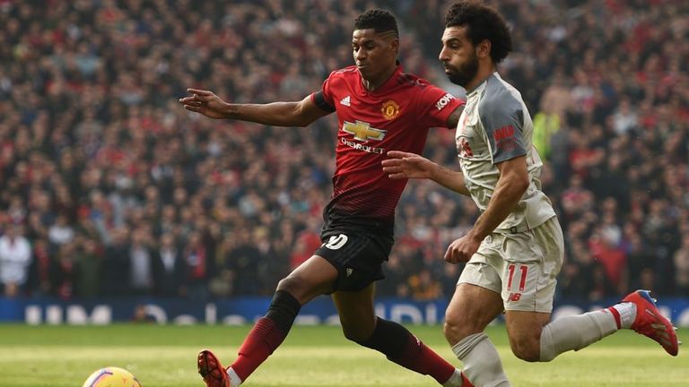 Manchester United&#39;s Marcus Rashford, left, and Liverpool&#39;s Mo Salah are seen competing for the ball 