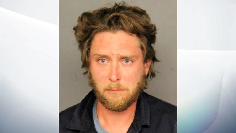 Matthew Dolloff is seen in a Denver Police Department&#39;s mugshot. Dolloff, 30, has been jailed on suspicion of first-degree murder in the fatal shooting of a protester, police said on October 11, 2020. Denver Police Department/Handout via REUTERS ATTENTION EDITORS - THIS IMAGE HAS BEEN SUPPLIED BY A THIRD PARTY.