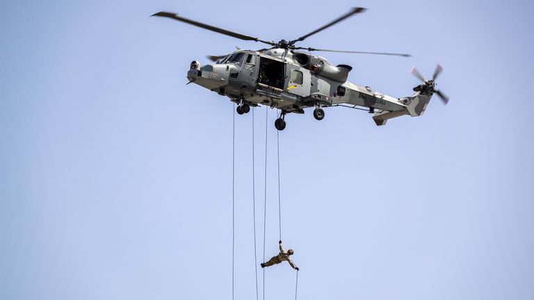 Some of the SBS fast-roped from a Merlin - a technique shown here by a Royal Marine in Gibraltar. Pic: Royal Navy/Barry Swainsbury