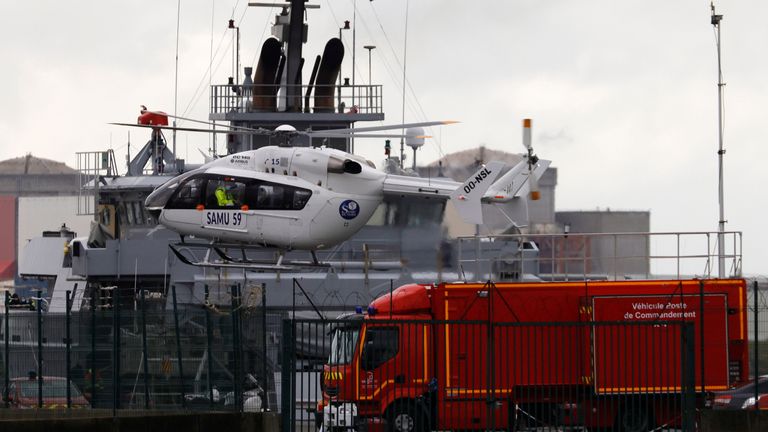 A French SAMU rescue helicopter lands close to a rescue vessel during a search operation after a boat carrying about 20 migrants capsized off the coast of Loon-Plage near Dunkirk, northern France, October 27, 2020. REUTERS/Pascal Rossignol
