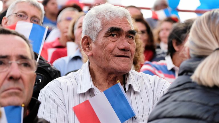 Loyalists hold French national flags