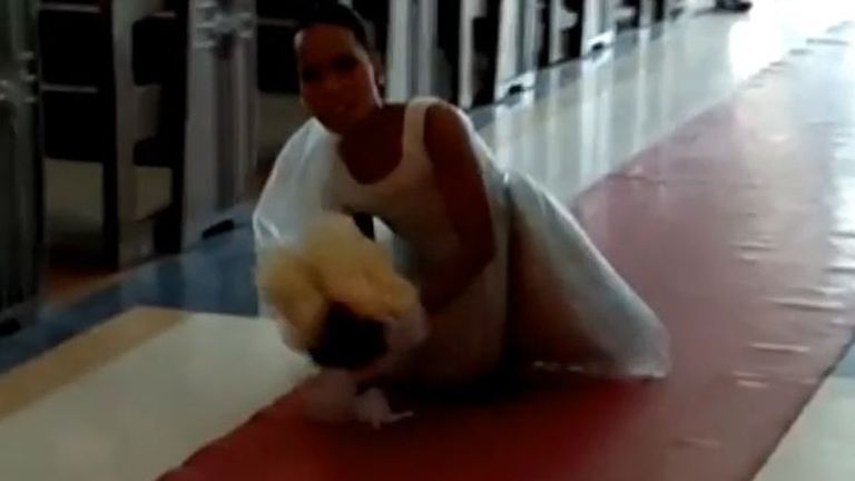 Bride with no legs makes her way down aisle