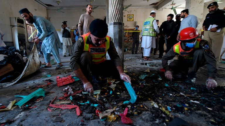 Security officials examine the site of a blast at a religious school in Peshawar on October 27, 2020. - At least four students were killed and dozens more wounded on October 27 when a bomb exploded during a class at their religious school in Pakistan, officials said. (Photo by Abdul MAJEED / AFP) (Photo by ABDUL MAJEED/AFP via Getty Images)