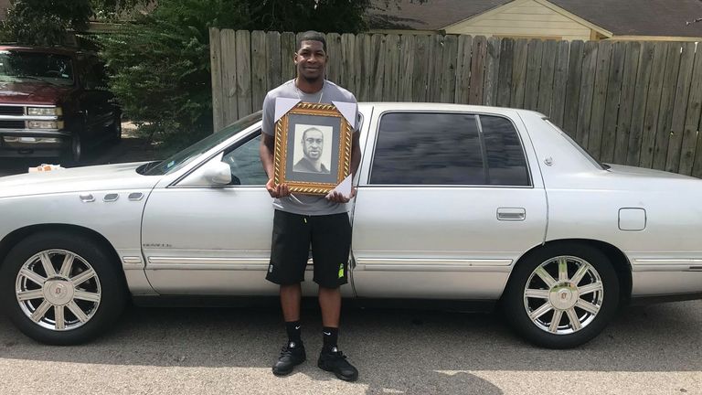 Quincy, 28, is pictured in front of his father&#39;s old car 