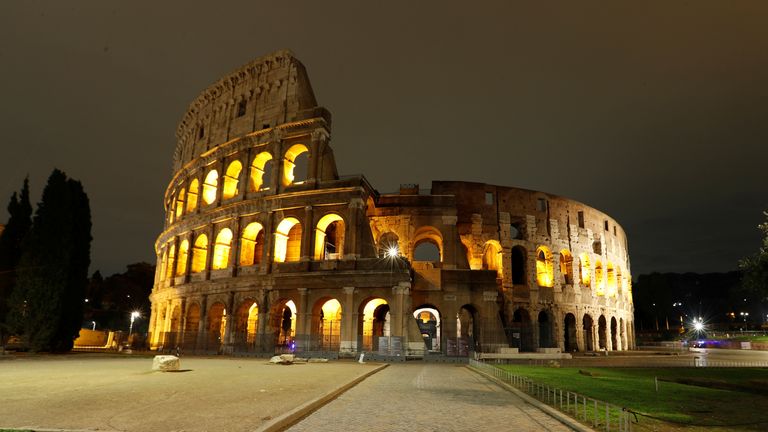 A deserted Colosseum is pictured as a curfew imposed by the region of Lazio from midnight to 5 a.m to curb the coronavirus disease (COVID-19) infections in Rome, Italy, October 24, 2020. REUTERS/Remo Casilli